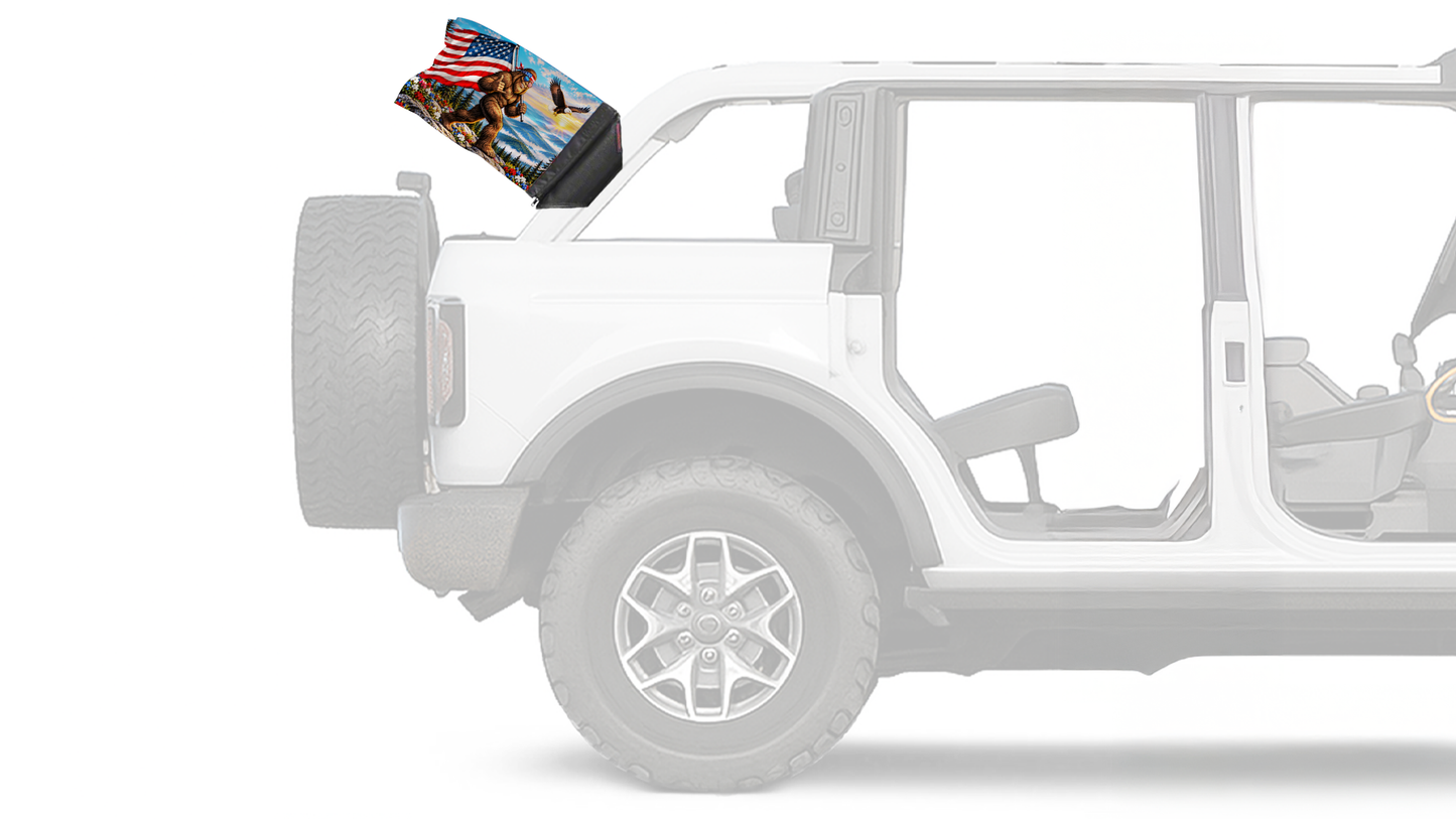 Bigfoot Patriot Forever Wave flag mounted on a Ford Bronco roll bar