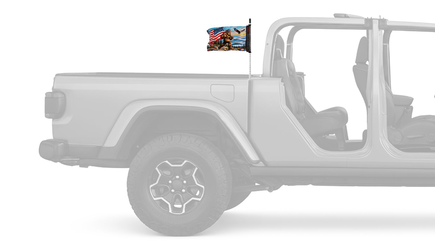 Bigfoot Patriot Forever Wave flag mounted on a Jeep Gladiator antenna