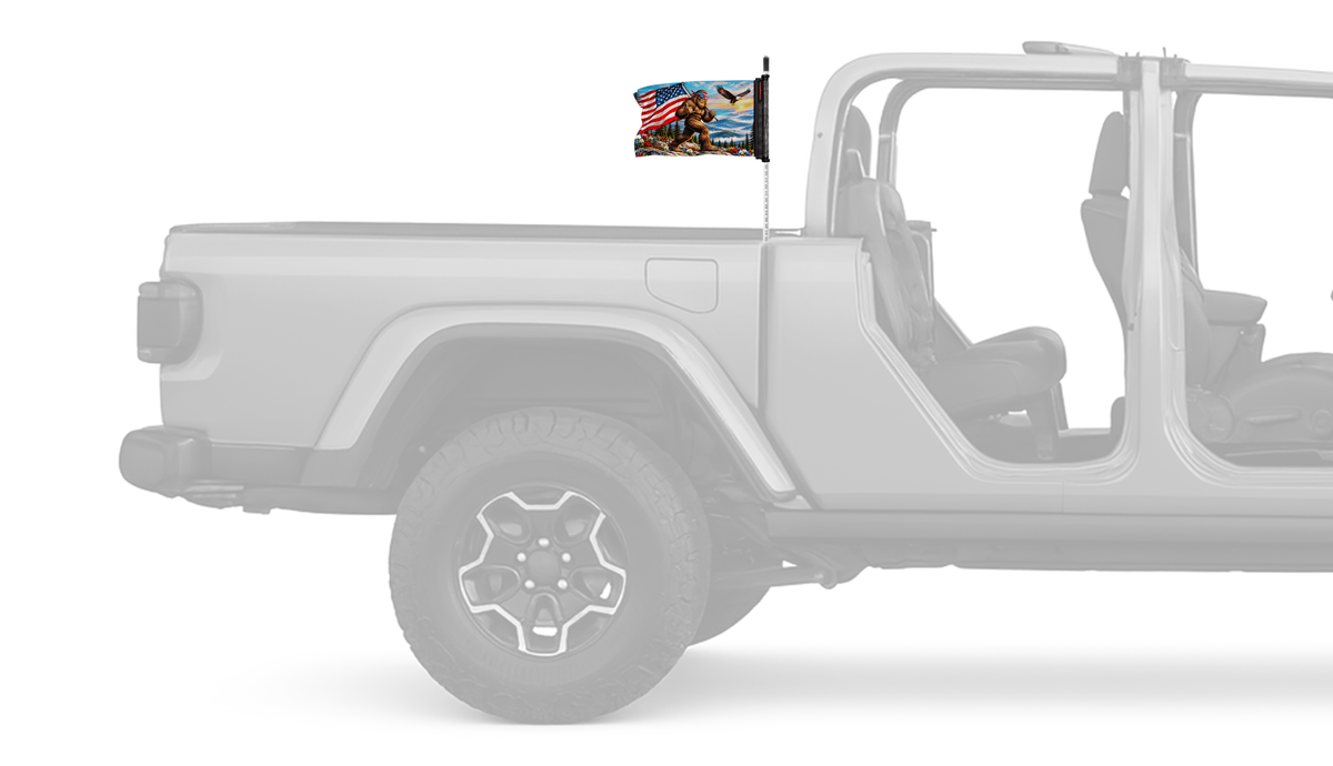 Bigfoot Patriot Forever Wave flag mounted on a Jeep Gladiator antenna